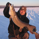 Ice Fisherman holding a large fish