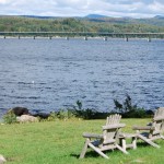 Adirondack chairs overlooking the water