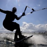 A wakeboarder out on the water