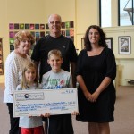 TRIATHLON DONATES TO LOCAL CHARITY